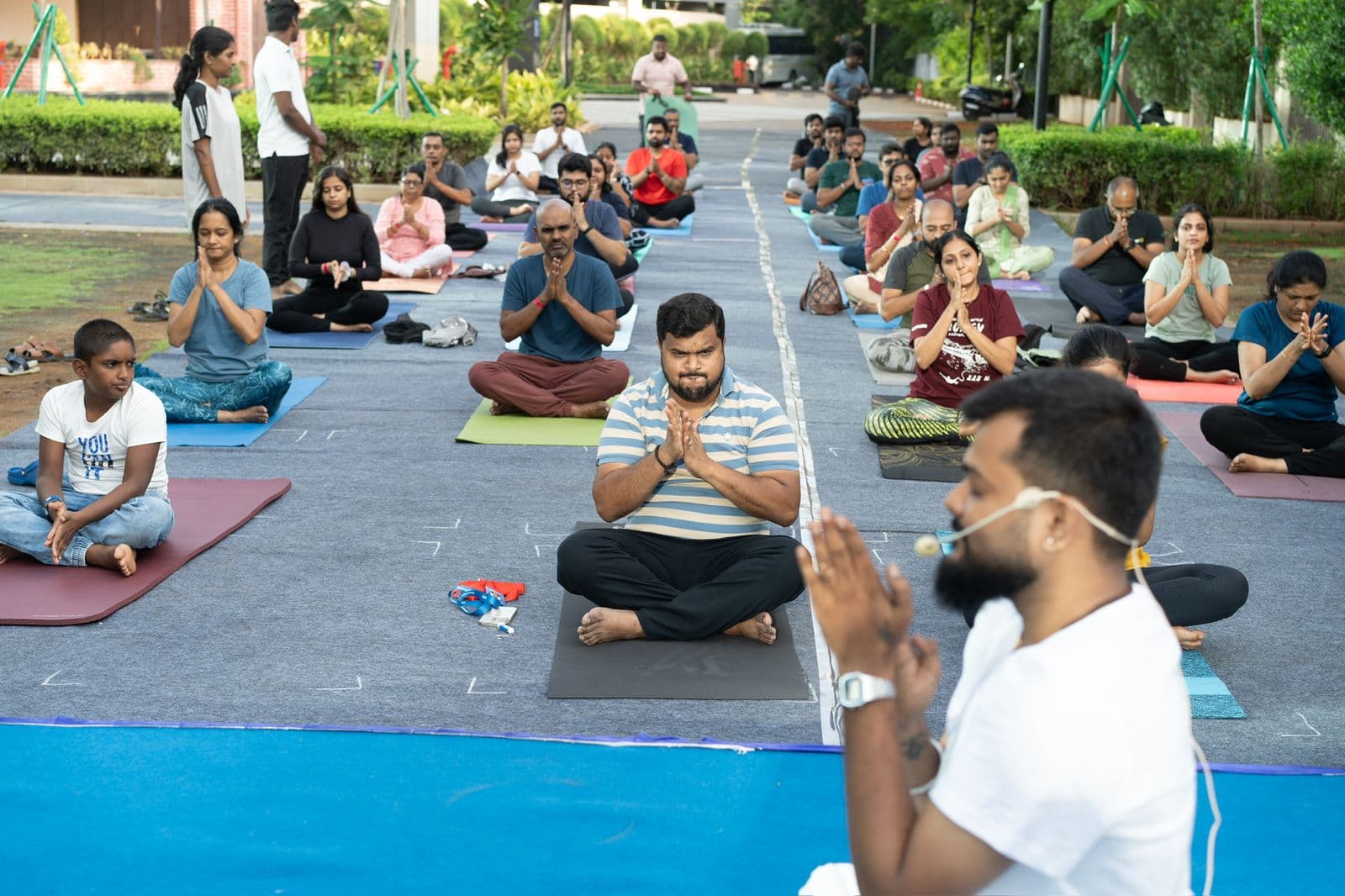 Durai guiding a Kalki Yoga community practice outdoors